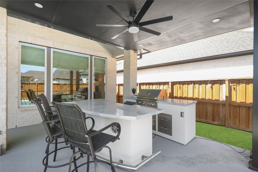 Exterior details and patio area of a home in Woodson’s Reserve, Spring (Image 24).
