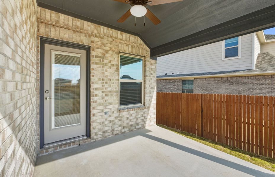 Exterior details and patio area of a home in Saddleback at Santa Rita Ranch, Liberty Hill (Image 22).