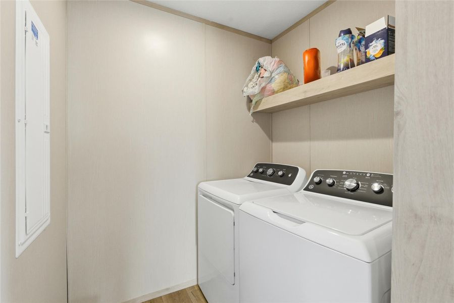 A dedicated laundry space provides practical, in-home convenience with a washer and dryer.