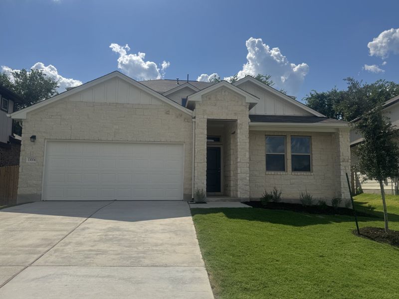 Front exterior of a new home in The Hills of Bear Creek, Austin, TX, highlighting curb appeal (Image 3).