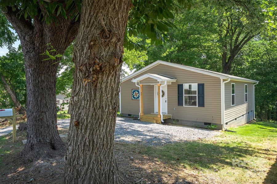 Front exterior of a new home in , Marion, NC, highlighting curb appeal (Image 1).