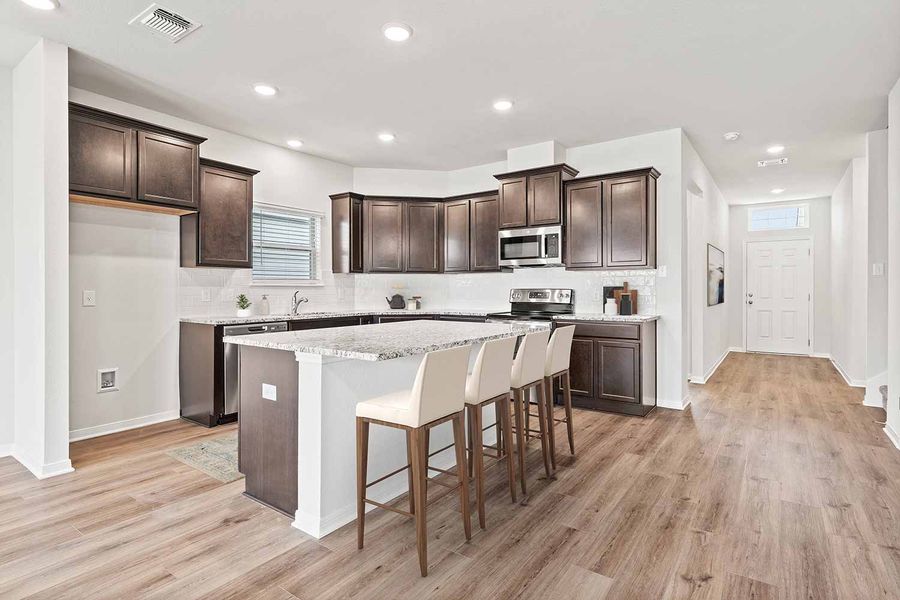 Representative furnished interior of a home built from the Fuller by Omega Builders in Southern Pointe, College Station (Image 4).