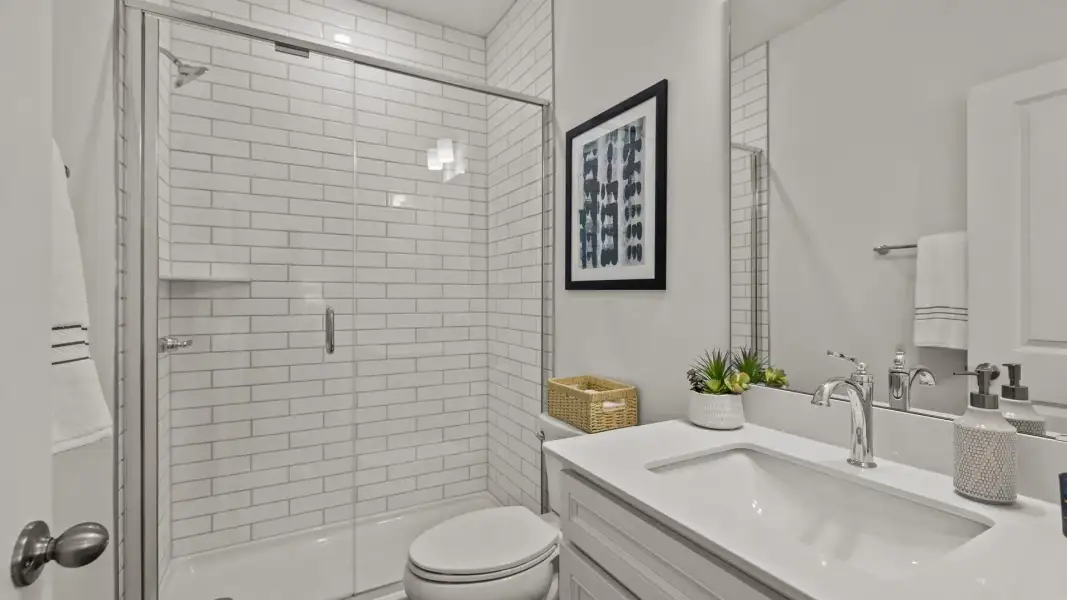 Secondary full bathroom with walk-in shower and fully tiled shower wall, in the Townsend Design by DRB Homes in York, SC Secondary full bathroom with walk-in shower and fully tiled shower wall, in the Townsend Design by DRB Homes in York, SC