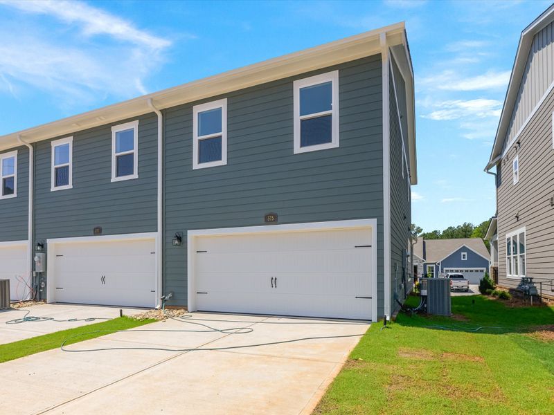 Front exterior of a new home in Hardy Pond Townhomes, Rock Hill, SC, highlighting curb appeal (Image 33). Front exterior of a new home in Hardy Pond Townhomes, Rock Hill, SC, highlighting curb appeal (Image 33).