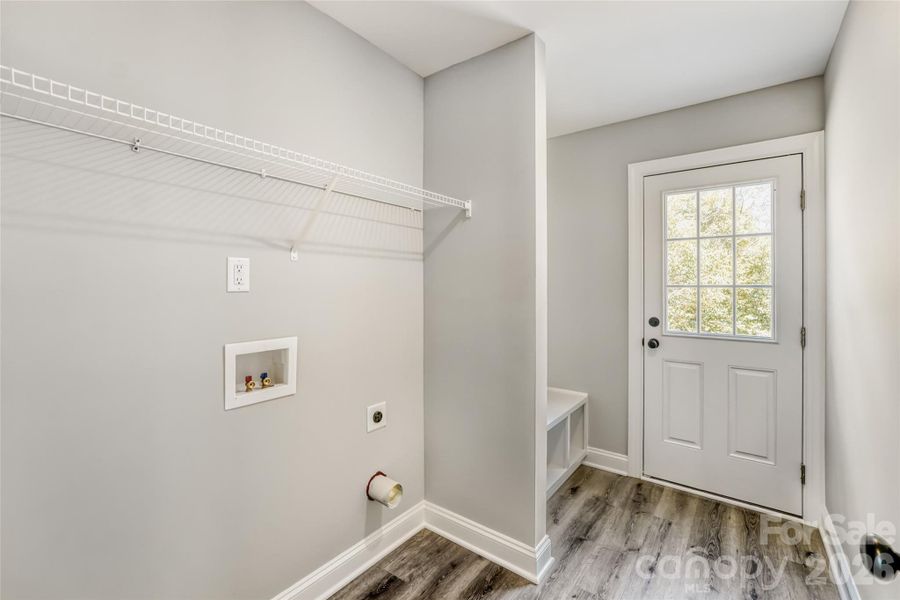 Spacious laundry room and mud room area Spacious laundry room and mud room area