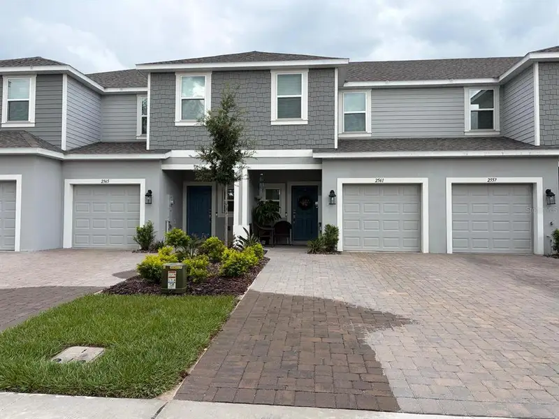 Front exterior of a new home in , Davenport, FL, highlighting curb appeal (Image 1). Front exterior of a new home in , Davenport, FL, highlighting curb appeal (Image 1).