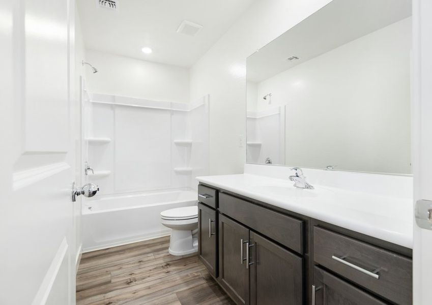 The guest bathrooms are spacious for your guests and family to start the day.
