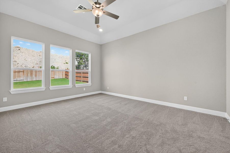Unfurnished room featuring light carpet, ceiling fan, and recessed lighting