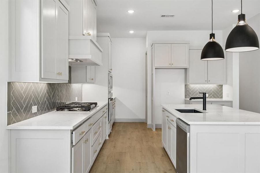 Beautiful cabinetry, gorgeous countertops and designer backsplash effortlessly pair with contemporary stainless steel to create the kitchen for the ages! Beautiful cabinetry, gorgeous countertops and designer backsplash effortlessly pair with contemporary stainless steel to create the kitchen for the ages!