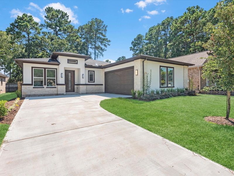 Front exterior of a new home in , Montgomery, TX, highlighting curb appeal (Image 2). Front exterior of a new home in , Montgomery, TX, highlighting curb appeal (Image 2).