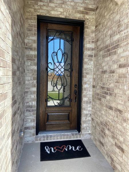 Elegant 8 foot iron & glass front door makes a great first impression! Elegant 8 foot iron & glass front door makes a great first impression!