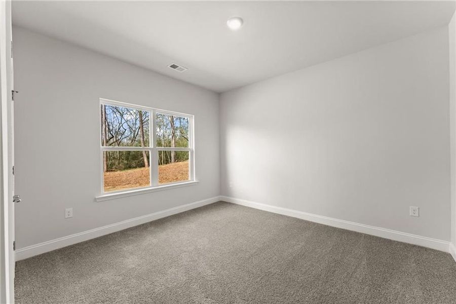 Spacious, unfurnished interior of a new home in Wood Creek Landing, Leland (Image 29).