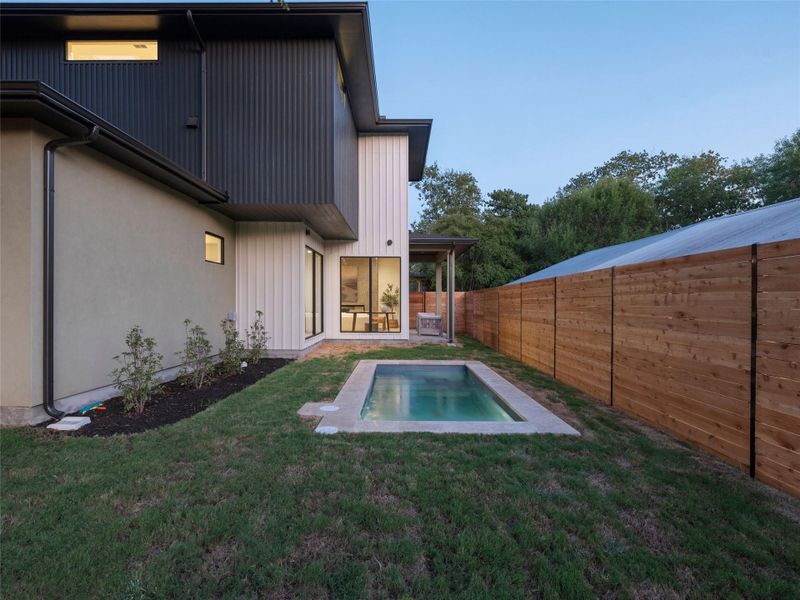 Back of house with a patio area and a fenced backyard