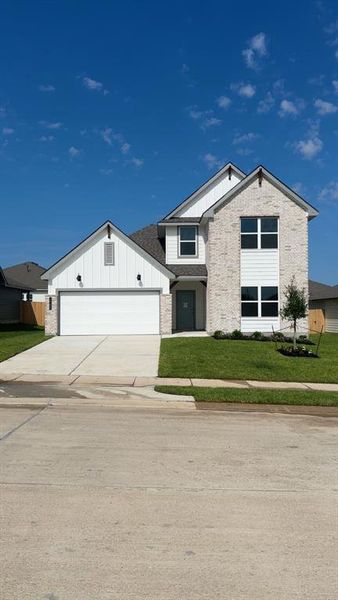 Front exterior of a new home in Liberty Village, Brenham, TX, highlighting curb appeal (Image 2).