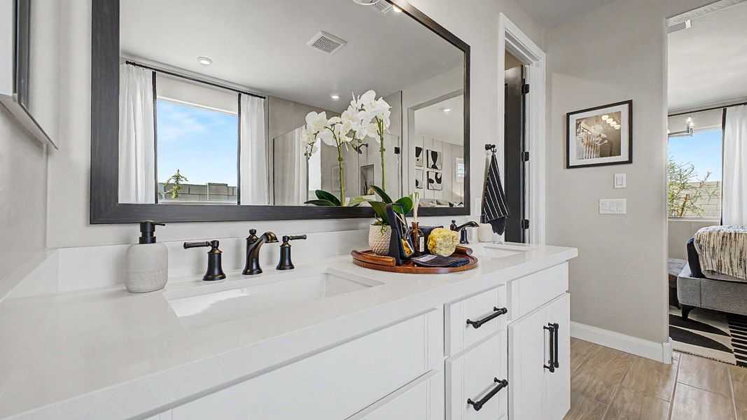 Spa-inspired primary bath with matte black finishes in this quick move-in new home at Saguaro Hills at Vistancia. Spa-inspired primary bath with matte black finishes in this quick move-in new home at Saguaro Hills at Vistancia.