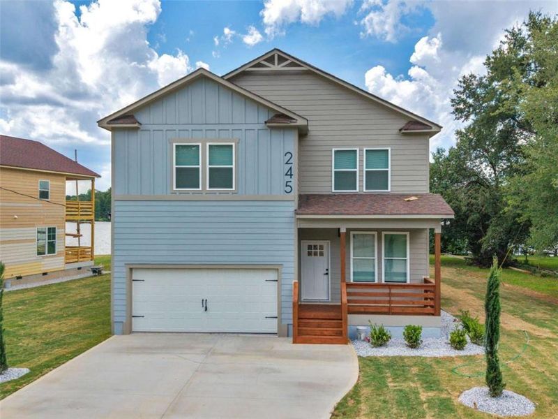 Front exterior of a new home in , Locust Grove, GA, highlighting curb appeal (Image 25). Front exterior of a new home in , Locust Grove, GA, highlighting curb appeal (Image 25).
