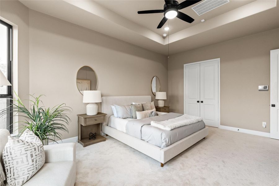 Generous primary bedroom with neutral tones, large windows for natural light, and an architecturally interesting ceiling. *Virtually Staged*