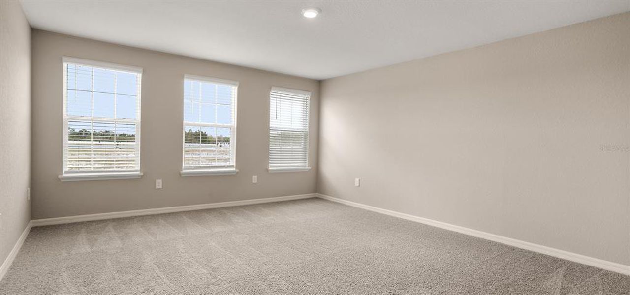 Spacious, unfurnished interior of a new home in Estates at Hickory Cove - Bungalows, St. Cloud (Image 8).