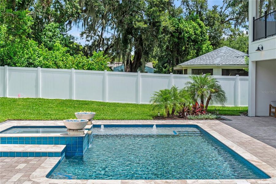 Heated pebbletec saltwater pool with spa, sunshelf with water feature, variable speed high efficiency pump, and 2 gas fireballs Heated pebbletec saltwater pool with spa, sunshelf with water feature, variable speed high efficiency pump, and 2 gas fireballs