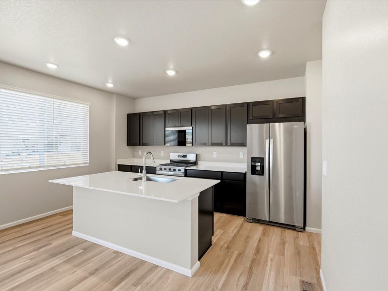 Furnished interior view inside a new home in Buffalo Highlands: The Flora Collection, Commerce City (Image 3).