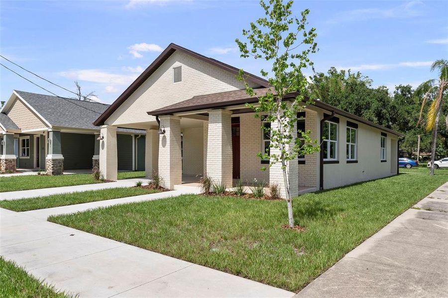 Front exterior of a new home in , Tampa, FL, highlighting curb appeal (Image 1). Front exterior of a new home in , Tampa, FL, highlighting curb appeal (Image 1).