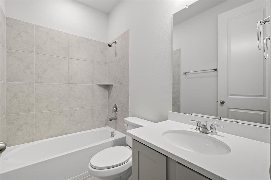 Bathroom with vanity and washtub / shower combination Bathroom with vanity and washtub / shower combination