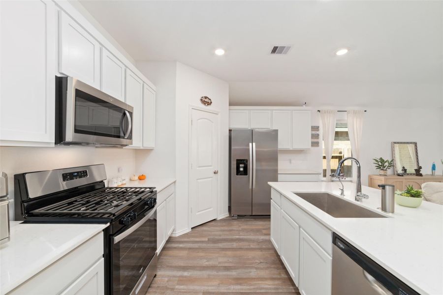 Furnished interior view inside a new home in Sunterra, Katy (Image 11).