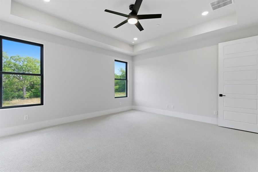 Private Primary Suite features Backyard Views, Great Windows & Spa Inspired Bathroom.