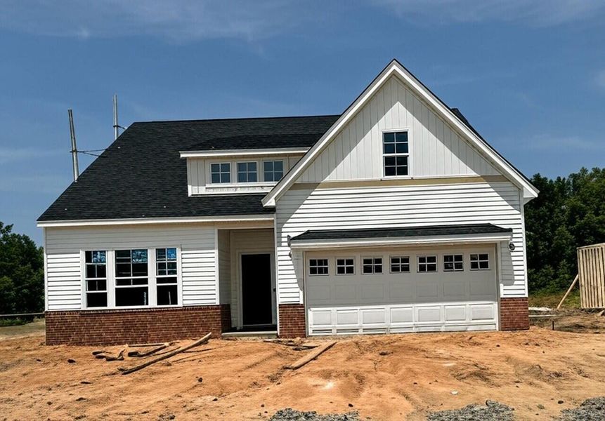 Front exterior of a new home in Fairway Woods at Wyboo, Manning, SC, highlighting curb appeal (Image 1). Front exterior of a new home in Fairway Woods at Wyboo, Manning, SC, highlighting curb appeal (Image 1).
