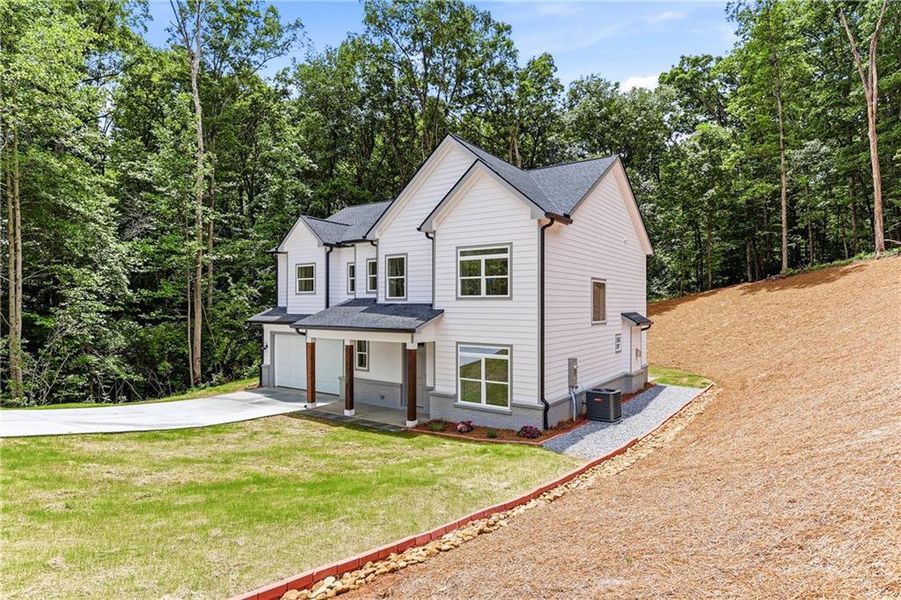 Front exterior of a new home in , Clermont, GA, highlighting curb appeal (Image 25). Front exterior of a new home in , Clermont, GA, highlighting curb appeal (Image 25).