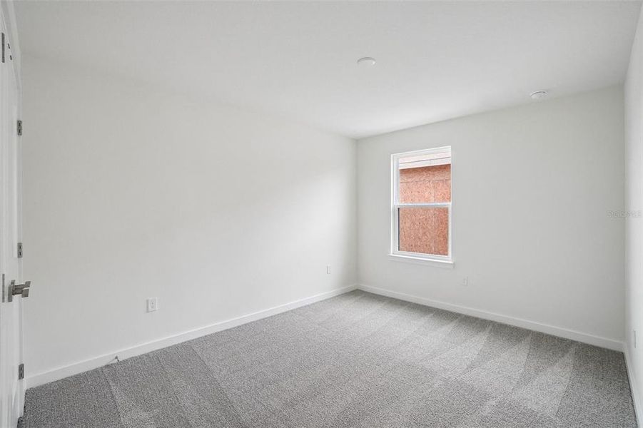 Spacious, unfurnished interior of a new home in Grasslands West, Lakeland (Image 19).