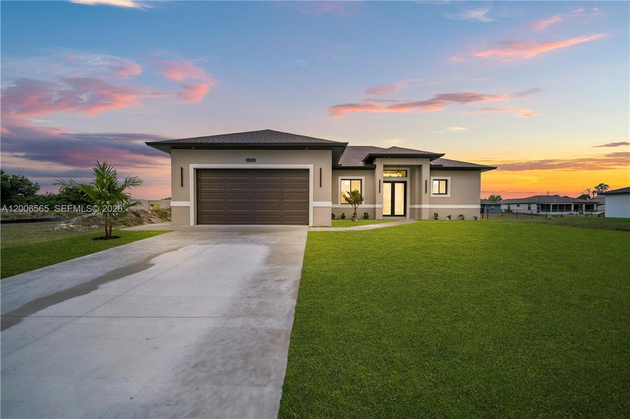 Front exterior of a new home in , Lehigh Acres, FL, highlighting curb appeal (Image 22).