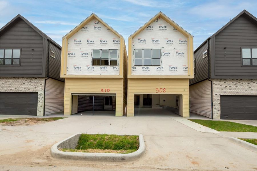 Front exterior of a new home in , Houston, TX, highlighting curb appeal (Image 29).