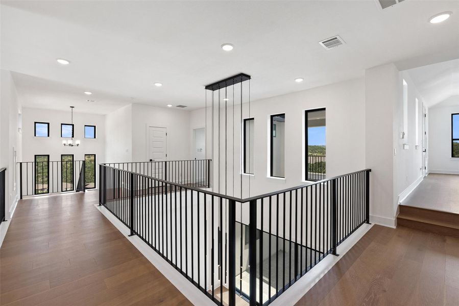 Furnished interior view inside a new home in The Estates at Rough Hollow Vista Ridge, Lakeway (Image 31).