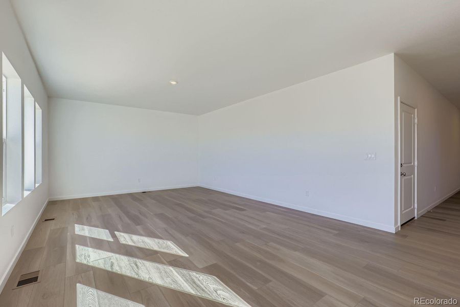 Spacious, unfurnished interior of a new home in Eastcreek Farm: The Camden Collection, Thornton (Image 10).