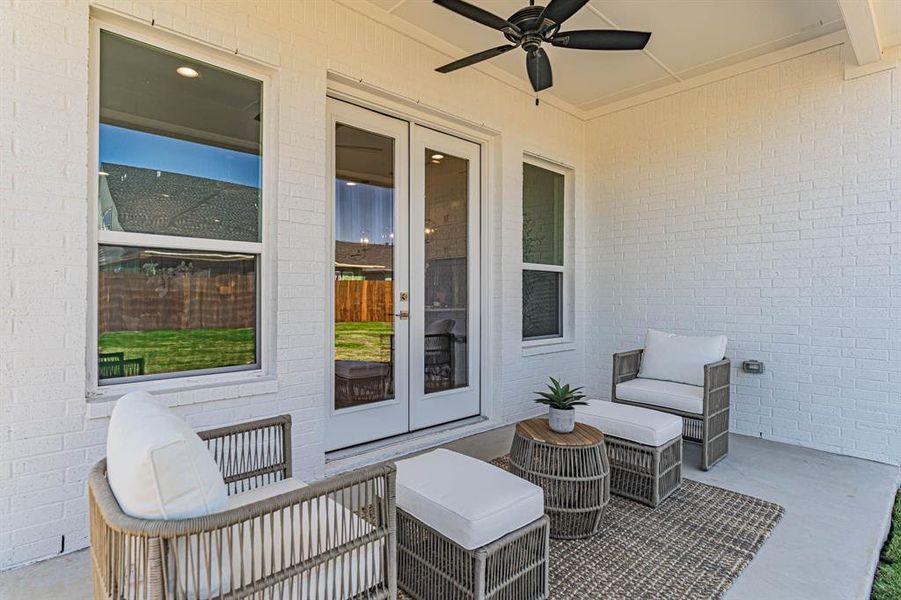 View of terrace with ceiling fan, french doors, and an outdoor hangout area