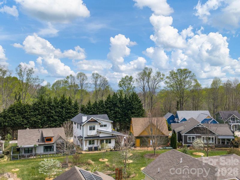 Drone perspective illustrating the potential seasonal mountain view from the future third-level deck at 48 Verde Drive.