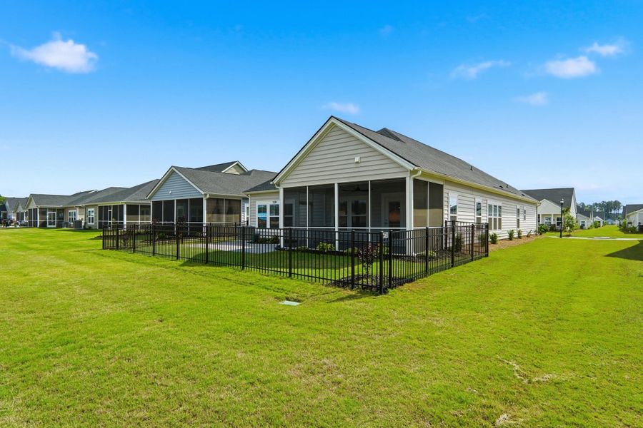 Exterior details and patio area of a home in Horizons at Summers Corner | 55+, Summerville (Image 36).