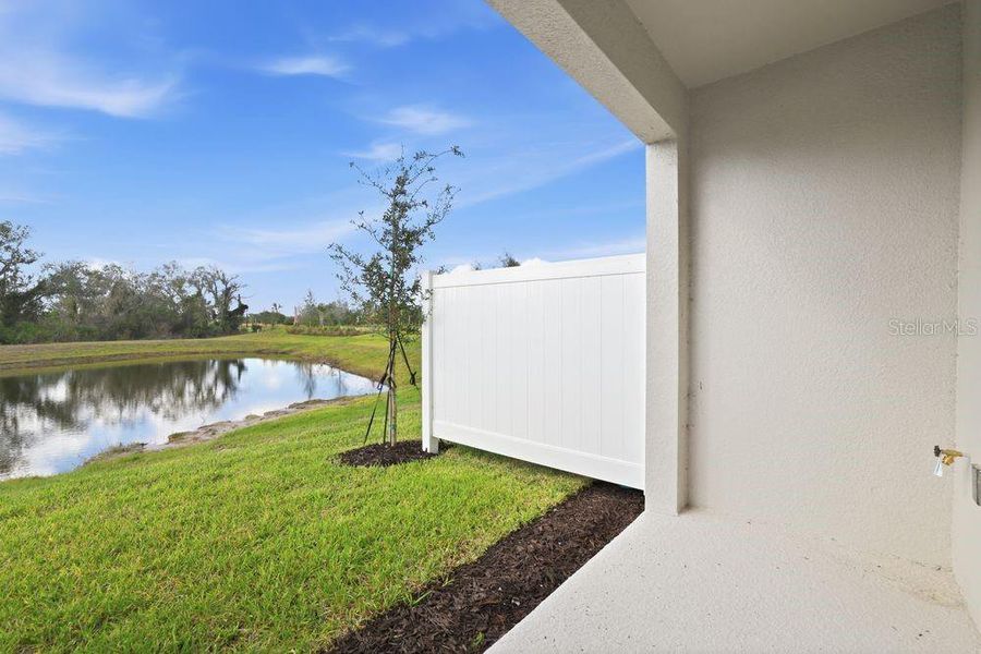 Exterior details and patio area of a home in The Towns at Firethorn, Parrish (Image 19).