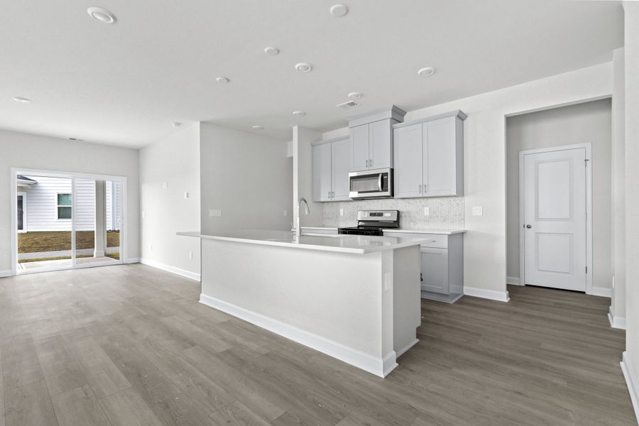 Furnished interior view inside a new home in Waterside - Boardwalk Series, Longs (Image 7).