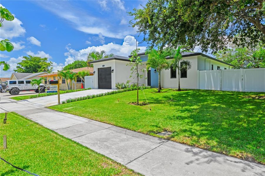 Front exterior of a new home in , Pompano Beach, FL, highlighting curb appeal (Image 25).