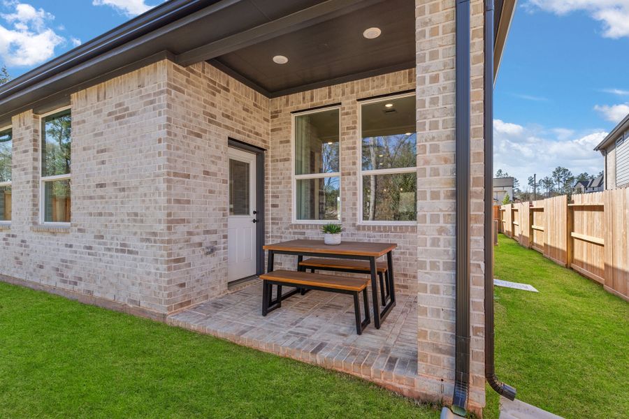 Front exterior of a new home in The Woodlands Hills, Willis, TX, highlighting curb appeal (Image 20). Front exterior of a new home in The Woodlands Hills, Willis, TX, highlighting curb appeal (Image 20).