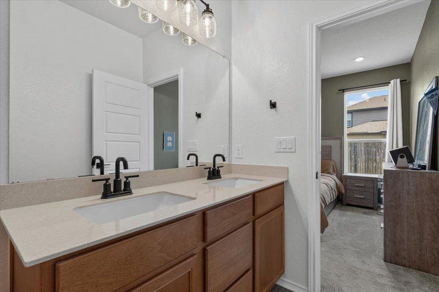 Double vanity in this bathroom provides convenience and ample counter space for daily routines.