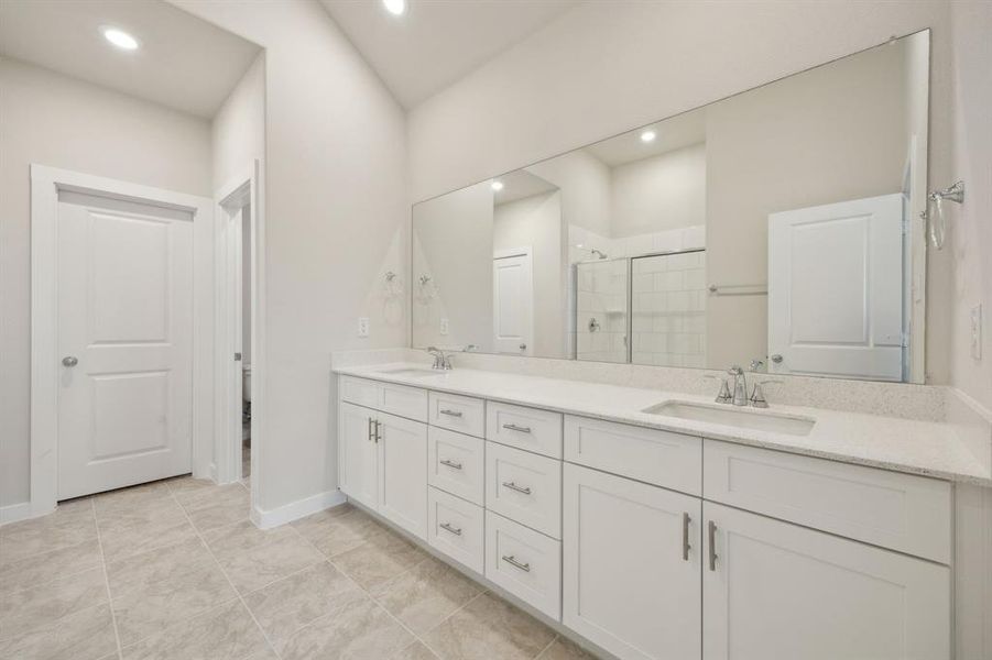 The large vanity features dual sinks in the primary bathroom