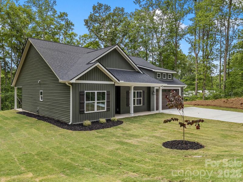Front exterior of a new home in , Travelers Rest, SC, highlighting curb appeal (Image 24).