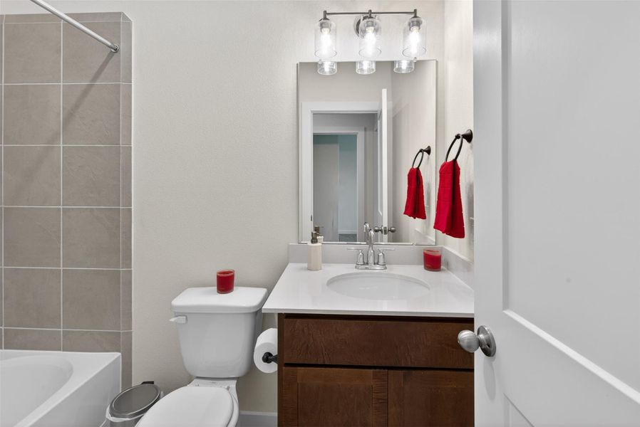Well-appointed full bath with a sleek vanity, bright lighting, and polished finishes that create a fresh and functional space. Well-appointed full bath with a sleek vanity, bright lighting, and polished finishes that create a fresh and functional space.