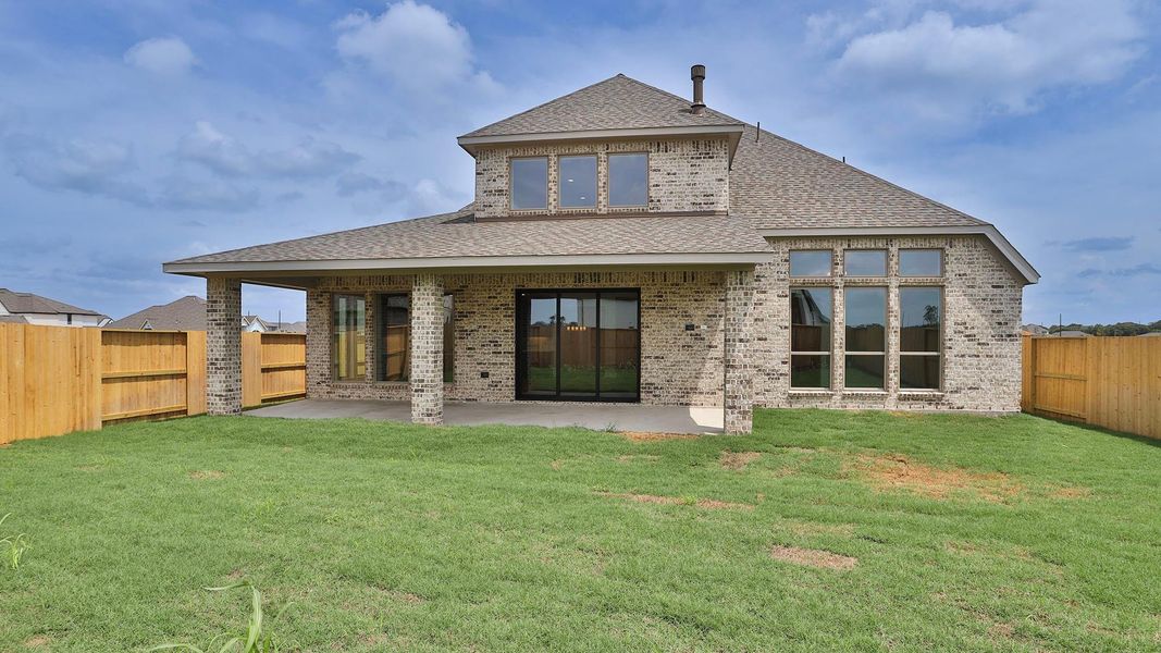 Exterior details and patio area of a home in Meridiana, Manvel (Image 2).