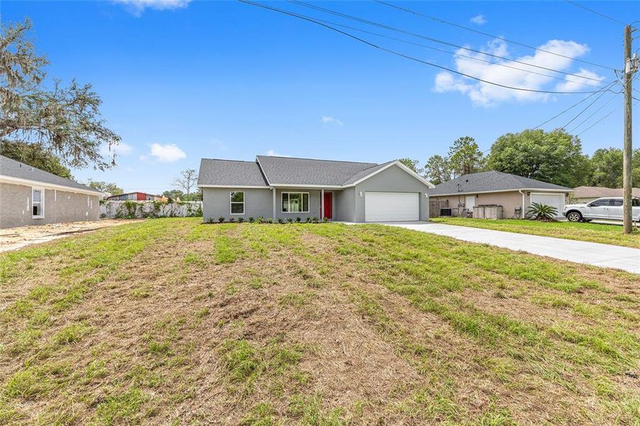 Front exterior of a new home in , Dunnellon, FL, highlighting curb appeal (Image 18).