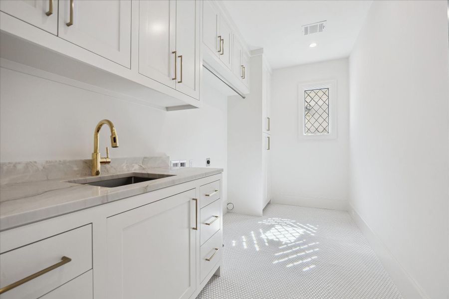 Second floor laundry room. Second floor laundry room.