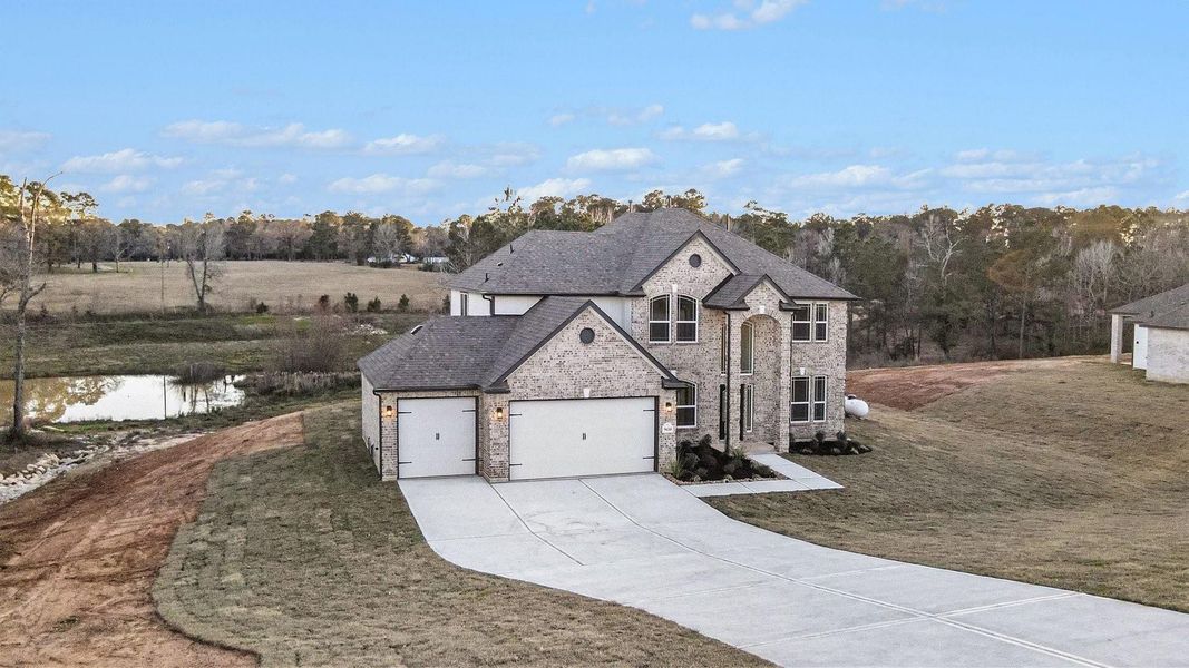 Front exterior of a new home in Rose Hill Estates, Willis, TX, highlighting curb appeal (Image 22).